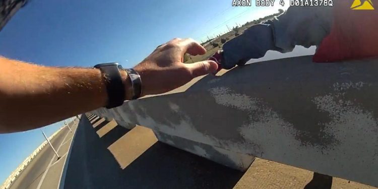 Video captures split-second rescue when officer catches man falling off bridge; Watch