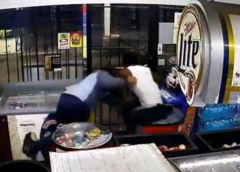Video show store clerk fighting back against armed robbery suspect near downtown Houston