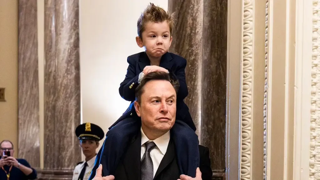Elon Musk's four-year-old son looks like his mini-me twin as he arrives at Capitol Hill on his dad's shoulders