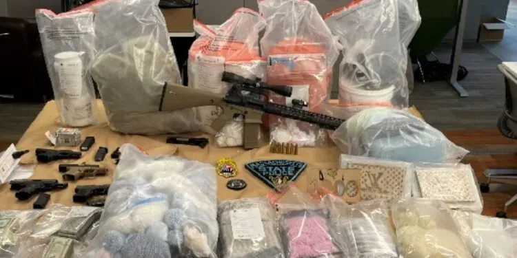 Man Apprehended In Massachusetts Accused Of Possessing 20+ Kilos Of Controlled Substances, Pill Press And 6 Firearms